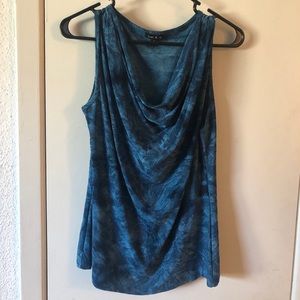 A sleeveless blue blouse